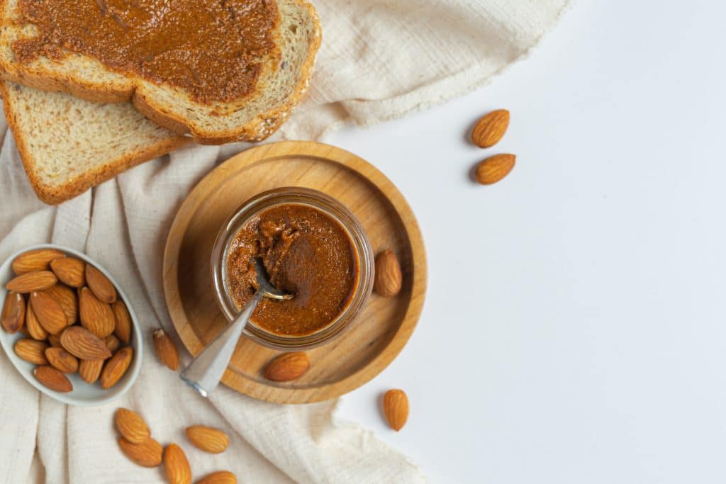 Raw Organic Almond Butter on white background