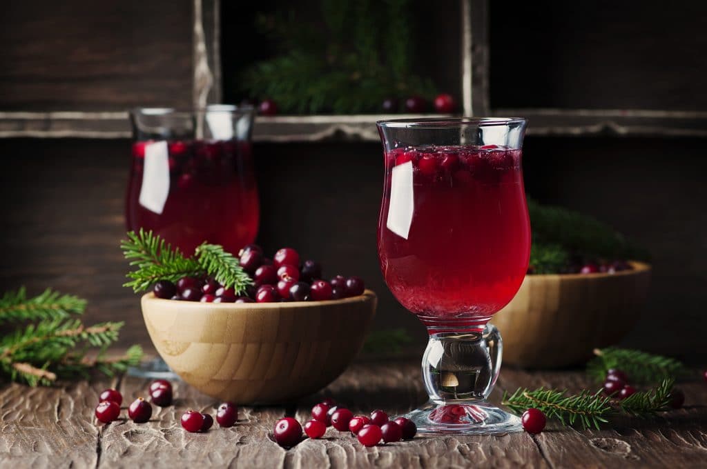 Fresh red cranberry juice on the vintage table, selective table