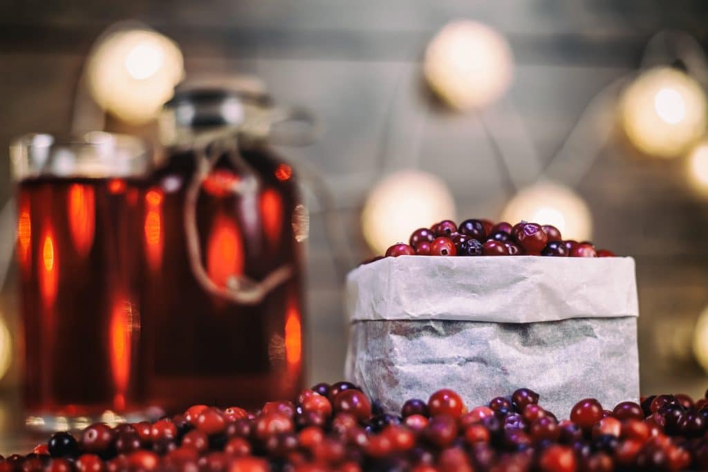 Heap of fresh Cranberries on vintage wooden background