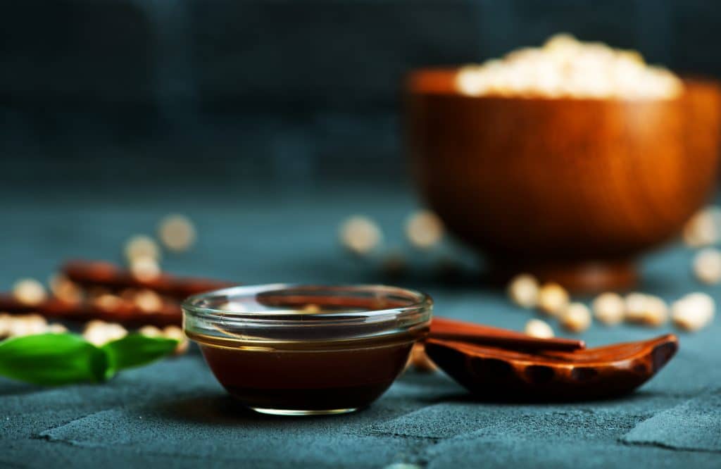 soy sauce in glass bowl and on a table