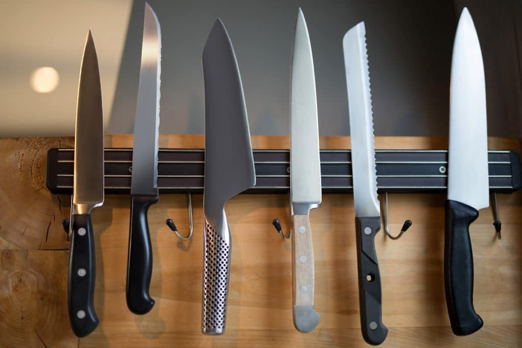 Close-up of kitchen knives hanging on the wall