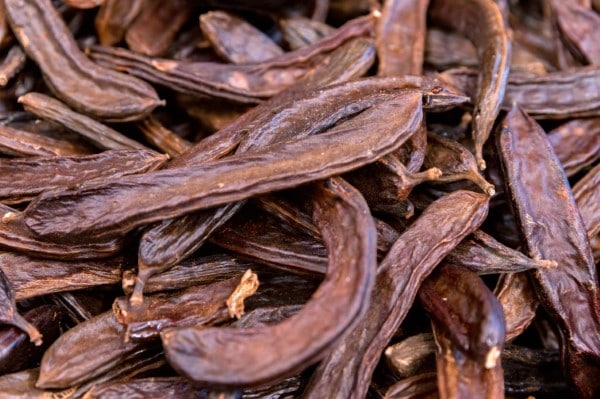 Close-up of carob pods or John's breadfruit horns at turkish market