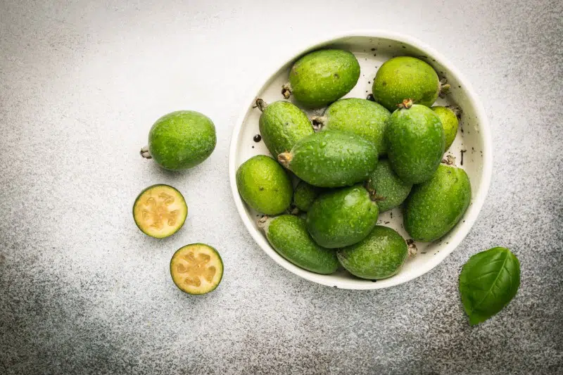 Tropical fruit feijoa in a bowl, top view. Healthy vegetarian food.