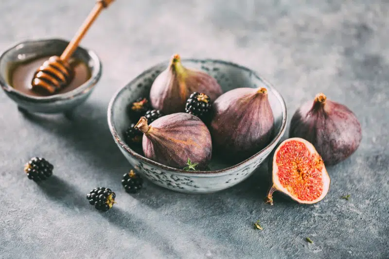 Healthy mediterranean figs and blackberries in a bowl.