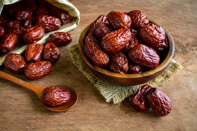 Dried jujube fruit on wooden table